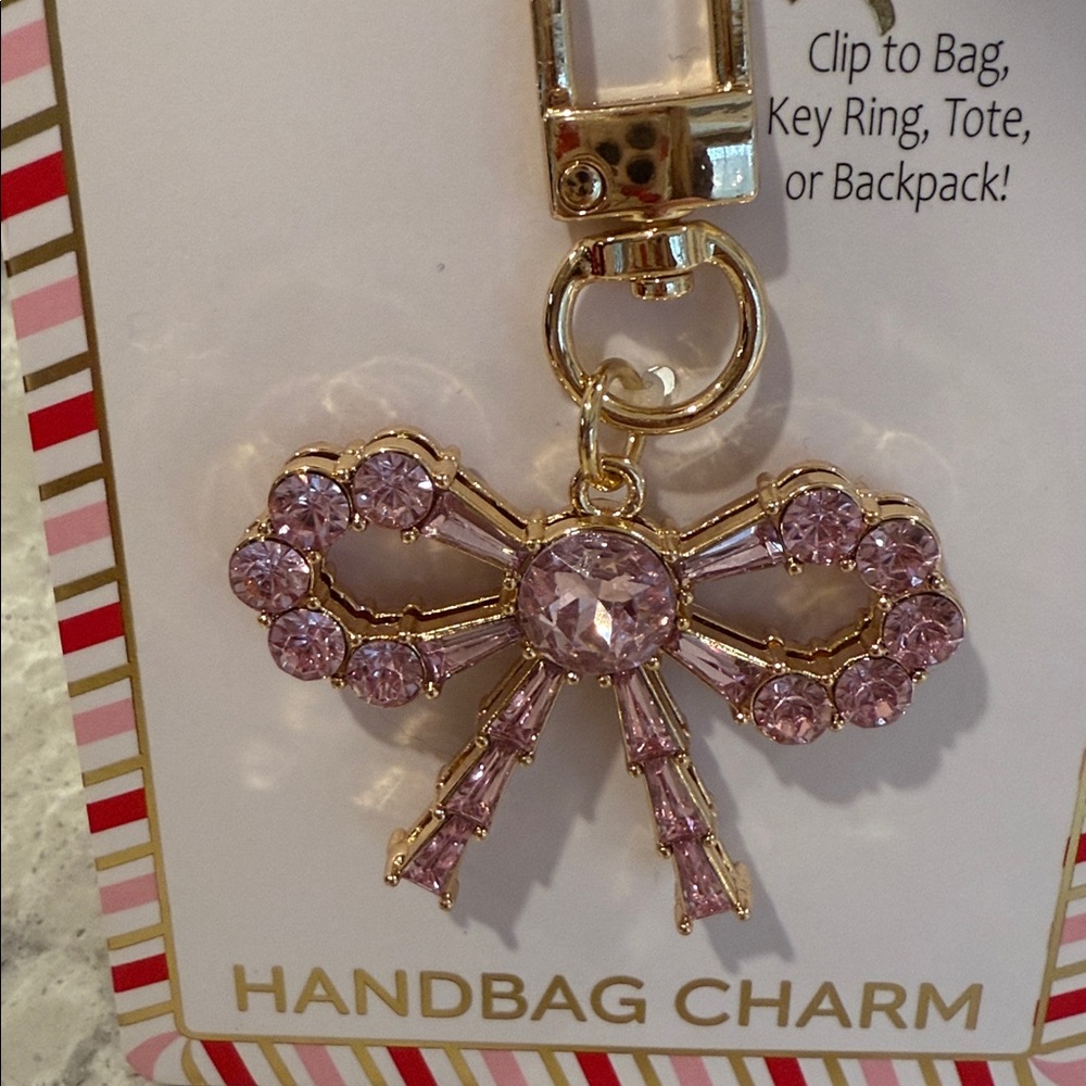 True to form, pink rhinestone bow handbag, charm